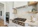 Well-equipped kitchen with double ovens and a large island with seating at 1480 Jeremy Cay Ct, Awendaw, SC 29429