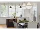 Modern kitchen with white cabinets, a large island, and stainless steel appliances at 1480 Jeremy Cay Ct, Awendaw, SC 29429