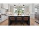 Bright kitchen featuring a center island with seating and hardwood floors at 1480 Jeremy Cay Ct, Awendaw, SC 29429