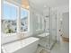 Luxurious bathroom with soaking tub, walk-in shower, and marble tile at 1480 Jeremy Cay Ct, Awendaw, SC 29429