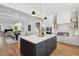 Spacious kitchen with island, stainless steel appliances, and hardwood floors at 1480 Jeremy Cay Ct, Awendaw, SC 29429