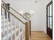 Elegant entryway with hardwood floors, white walls, and a grand staircase at 1480 Jeremy Cay Ct, Awendaw, SC 29429