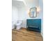 Charming bathroom with teal vanity and hardwood floors at 3869 Delinger Dr, Mount Pleasant, SC 29466