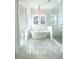 Luxurious bathroom with soaking tub, marble floors, and walk-in shower at 3869 Delinger Dr, Mount Pleasant, SC 29466