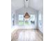 Spacious dining room with hardwood floors, large windows, and a stunning chandelier at 3869 Delinger Dr, Mount Pleasant, SC 29466