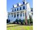 White two-story house, front porch, landscaping at 3869 Delinger Dr, Mount Pleasant, SC 29466
