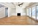 Bright living room with hardwood floors, fireplace, built-in shelving, and access to outdoor patio at 3869 Delinger Dr, Mount Pleasant, SC 29466