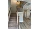 Elegant staircase with carpeted steps and wooden railing at 306 Mizell Rd, Dorchester, SC 29437