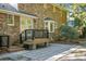 Brick patio adjacent to home with deck and stairs at 112 Huckleberry Ln, Summerville, SC 29485