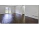 Bright living room featuring dark brown wood-look flooring and access to a patio at 809 Andrea Ln, Hanahan, SC 29410
