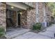 Exterior view of building entrance with brick facade, metal staircase, and landscaping at 809 Andrea Ln, Hanahan, SC 29410