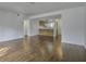 Spacious living room with dark brown wood-look flooring and an open concept layout at 809 Andrea Ln, Hanahan, SC 29410