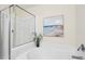 Bathroom with a shower/tub combo and a stylish seascape painting at 3065 Sugarberry Ln, Johns Island, SC 29455