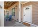 Inviting front porch with seating and a welcoming door at 3065 Sugarberry Ln, Johns Island, SC 29455