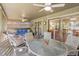 Relaxing screened porch with seating area and outdoor dining table at 1101 Summerwind Ln, Seabrook Island, SC 29455