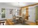 Coastal dining area with glass table and white chairs at 1101 Summerwind Ln, Seabrook Island, SC 29455