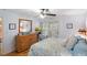 Bedroom with king bed, dresser, and access to patio at 1101 Summerwind Ln, Seabrook Island, SC 29455