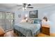 Main bedroom with king bed, light blue walls, and access to patio at 1101 Summerwind Ln, Seabrook Island, SC 29455