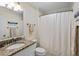 Small bathroom with granite countertop, single sink, and shower/tub combo at 1101 Summerwind Ln, Seabrook Island, SC 29455