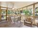 Spacious screened porch with outdoor seating and view of lush greenery at 1101 Summerwind Ln, Seabrook Island, SC 29455