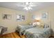 Bedroom with twin beds, light yellow walls, and ceiling fan at 1101 Summerwind Ln, Seabrook Island, SC 29455