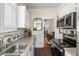 Kitchen with granite countertops, stainless steel appliances, and view to dining room at 240 Calhoun St, Charleston, SC 29401