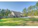 Large backyard with a pool and patio area at 1010 Deep Gap Rd, Ridgeville, SC 29472