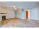 Living room with fireplace, wood-look floors, and ceiling fan at 607 Waterwood Dr, Goose Creek, SC 29445