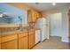 Kitchen with wood cabinets, tiled floors, and a stainless steel sink at 607 Waterwood Dr, Goose Creek, SC 29445