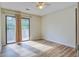 Bedroom with wood-look floors and access to a private balcony at 607 Waterwood Dr, Goose Creek, SC 29445