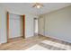 Bedroom with wood-look floors, closet, and additional door at 607 Waterwood Dr, Goose Creek, SC 29445