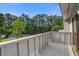 Private deck overlooking a wooded area and parking lot at 607 Waterwood Dr, Goose Creek, SC 29445