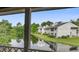 Enjoy a peaceful water view from this screened porch at 607 Waterwood Dr, Goose Creek, SC 29445