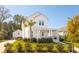 Two-story white house with a palm tree and front yard at 3559 Clambank Dr, Mount Pleasant, SC 29466