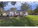 View of the house from the backyard, showing deck and lawn at 1026 Holcombe Rd, Hanahan, SC 29410