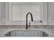 Modern kitchen sink with black gooseneck faucet and granite countertop at 1910 Kerry St, North Charleston, SC 29406