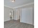 Bright bedroom with wood-look floors and a large closet at 1910 Kerry St, North Charleston, SC 29406