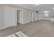 Open living space with hardwood floors and access to kitchen and bedrooms at 1910 Kerry St, North Charleston, SC 29406