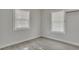 Bright bedroom with hardwood floors and two windows at 1910 Kerry St, North Charleston, SC 29406