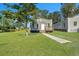 Front view of a charming bungalow, showcasing the front porch and yard at 1910 Kerry St, North Charleston, SC 29406