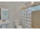 Clean bathroom with glass block shower and tiled walls at 1910 Kerry St, North Charleston, SC 29406