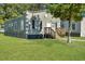 Side view of a charming bungalow with a grassy yard at 1910 Kerry St, North Charleston, SC 29406