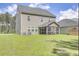 Large backyard with green grass and screened porch at 229 Camellia Bloom Dr, Moncks Corner, SC 29461