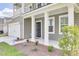 Two-story house with gray siding, white columns, and a two-car garage at 229 Camellia Bloom Dr, Moncks Corner, SC 29461