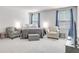 Main bedroom with two armchairs and a TV at 229 Camellia Bloom Dr, Moncks Corner, SC 29461