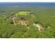 Aerial view of property highlighting home, pool, and surrounding land at 824 Hill Branch Rd, Ridgeville, SC 29472