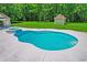 Freeform swimming pool with attached spa and fence at 824 Hill Branch Rd, Ridgeville, SC 29472