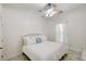Bright bedroom with ceiling fan and white bedding at 824 Hill Branch Rd, Ridgeville, SC 29472