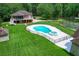 Aerial view of house, pool, and expansive property with lush trees at 824 Hill Branch Rd, Ridgeville, SC 29472