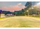 Well-lit tennis court, ideal for recreational activities at 824 Hill Branch Rd, Ridgeville, SC 29472